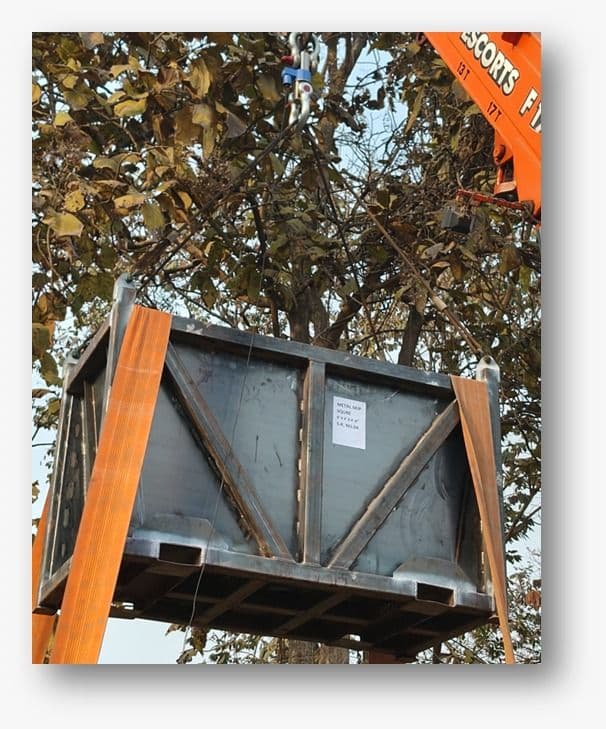 Orange crane with metal basket